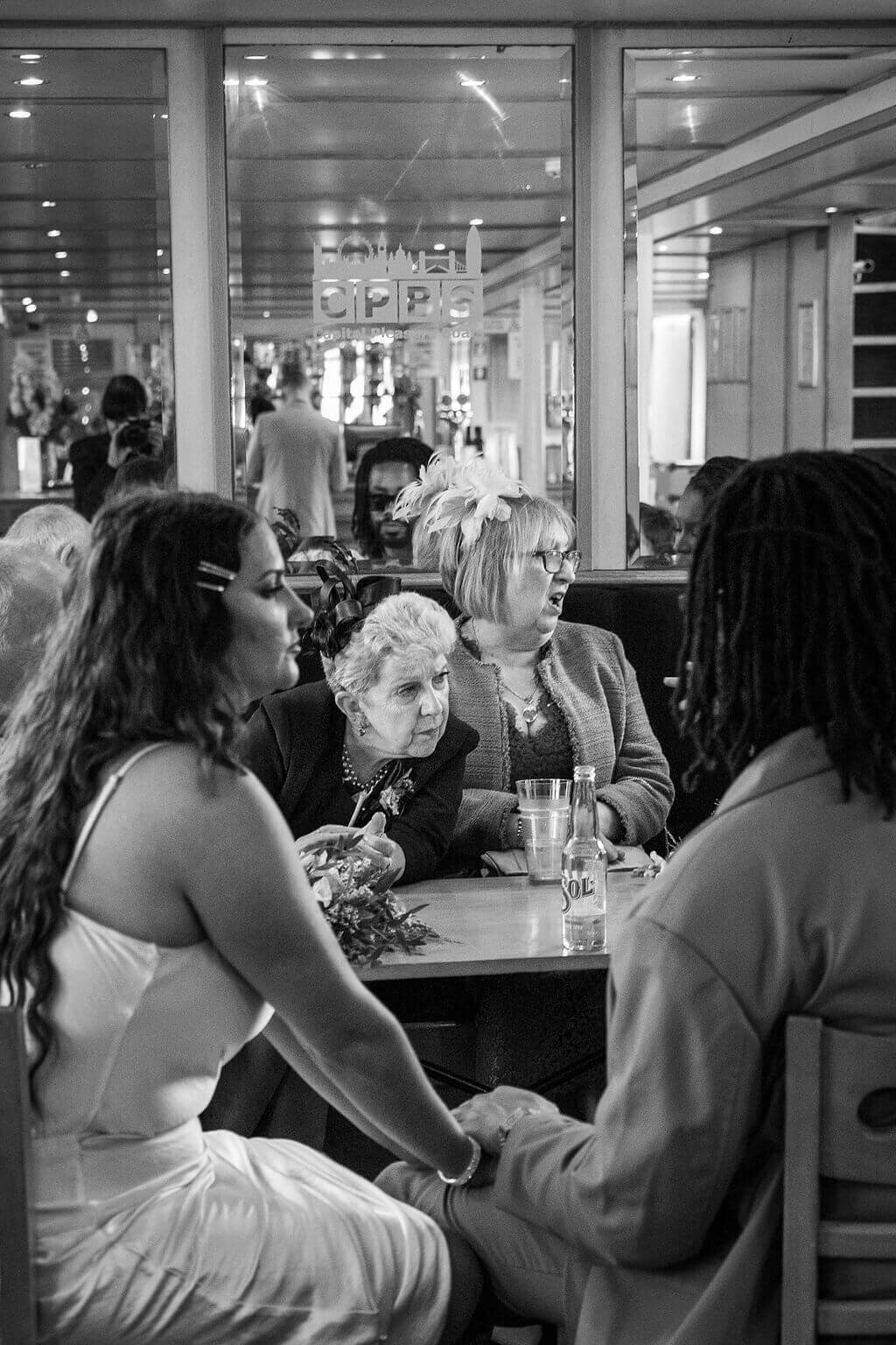 Funny photo of aunties gossiping at London Wedding Reception