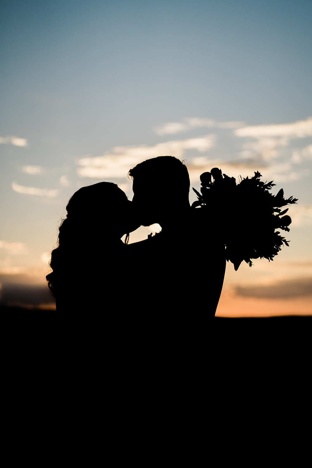 Silhoutte of couple kissing