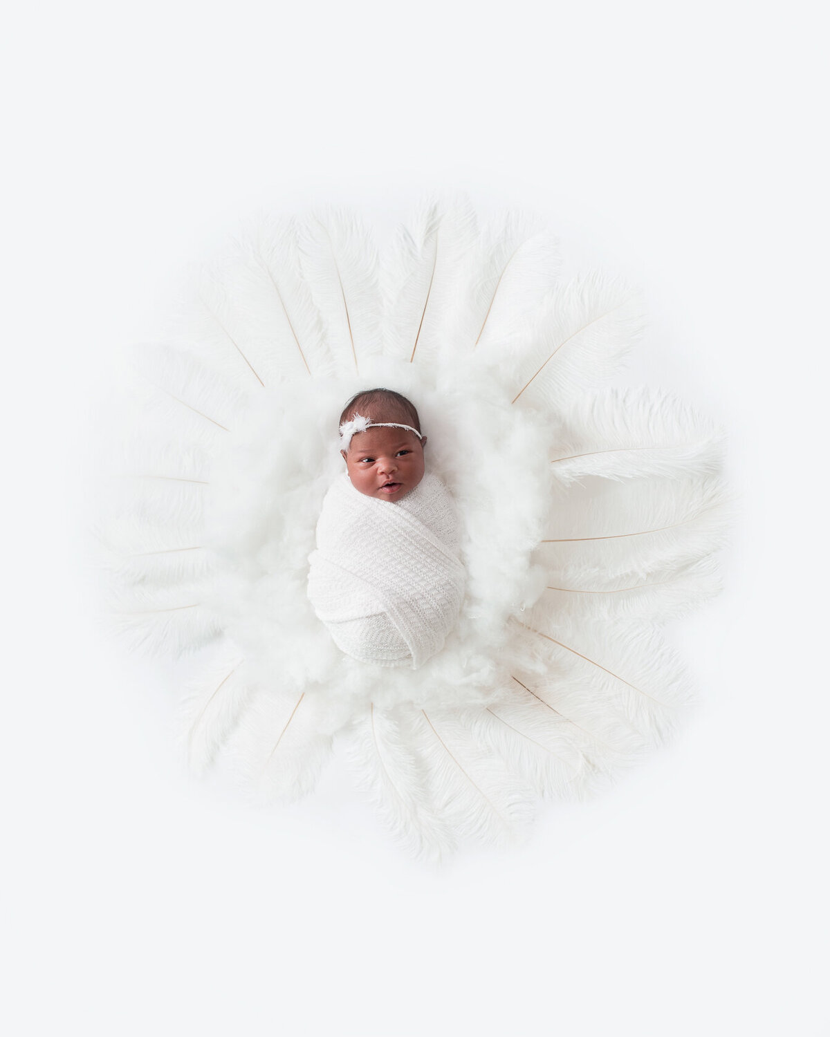 Newborn White themed photoshoot by Laura King