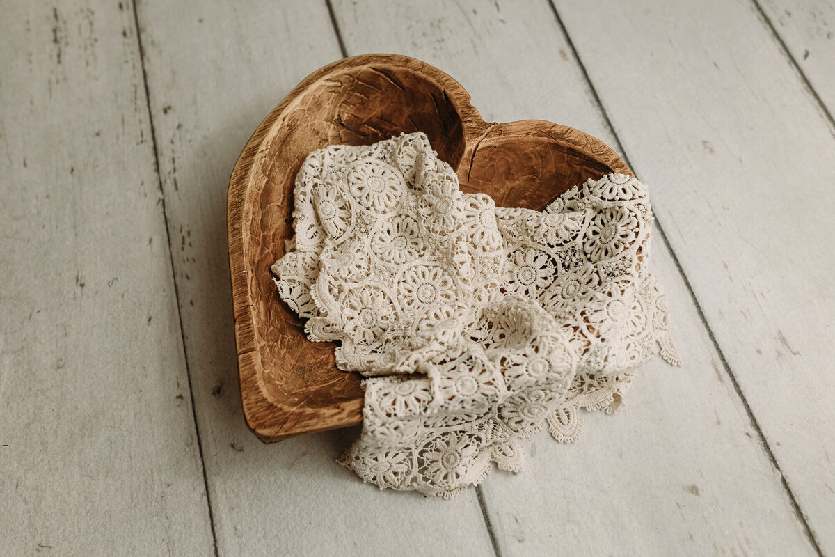 Wooden heart bowl used for newborn sessions at Jennifer Brandes Photography.