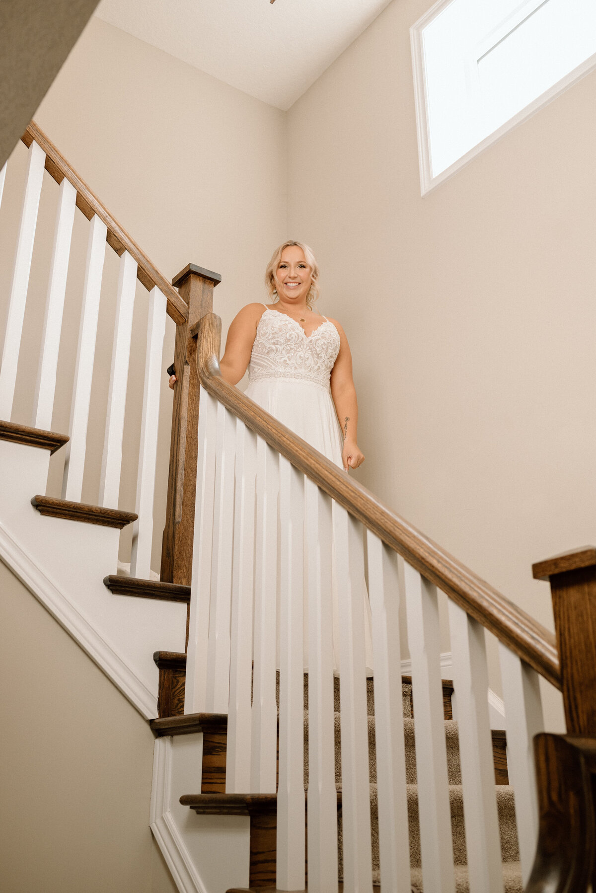 bride comes down the stairs