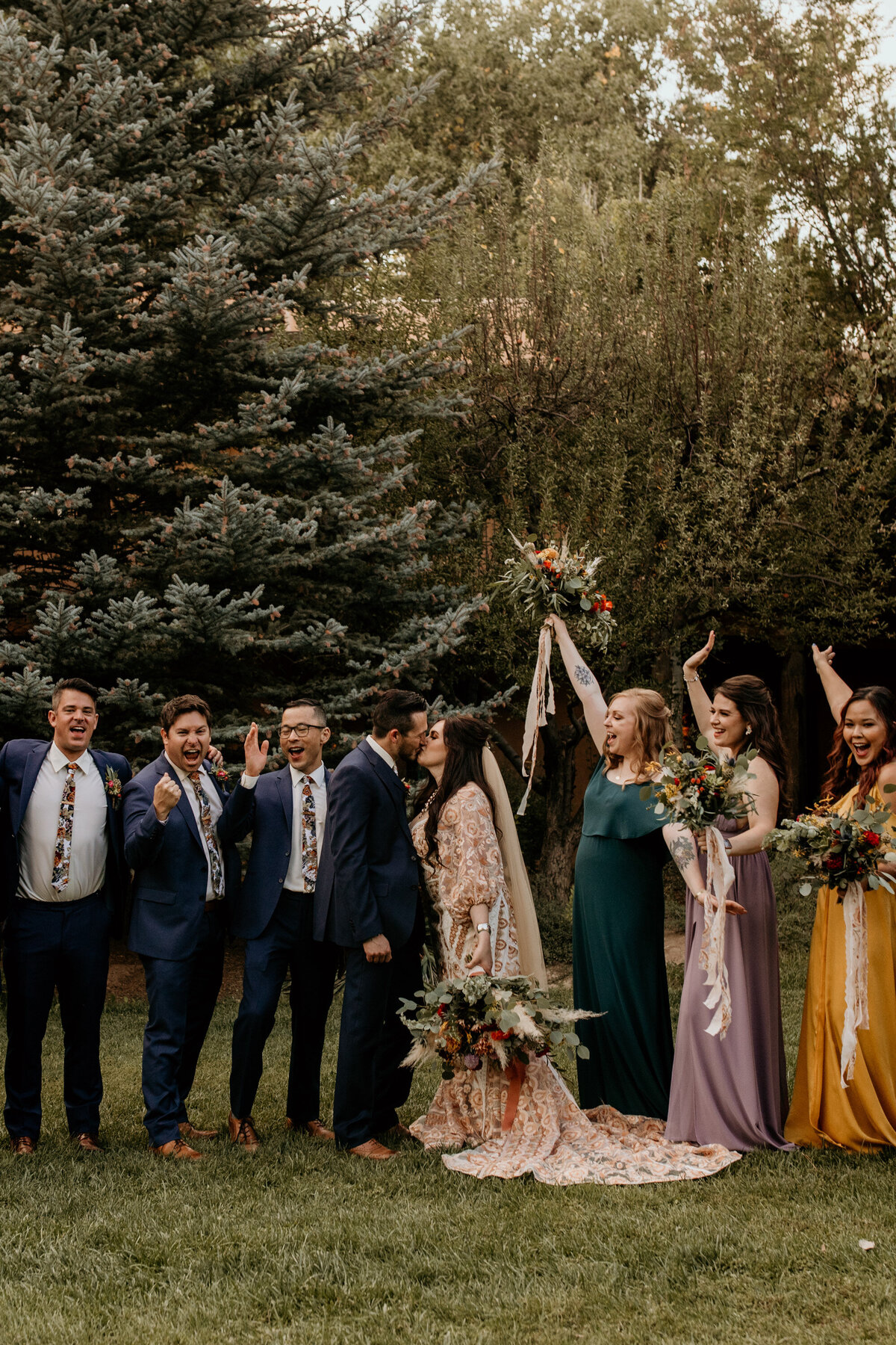 bride and groom with wedding party in Taos