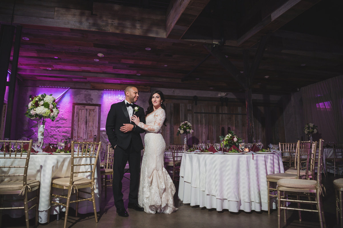 photo of bride and groom posing in wedding reception hall at The Loft by Bridgeview