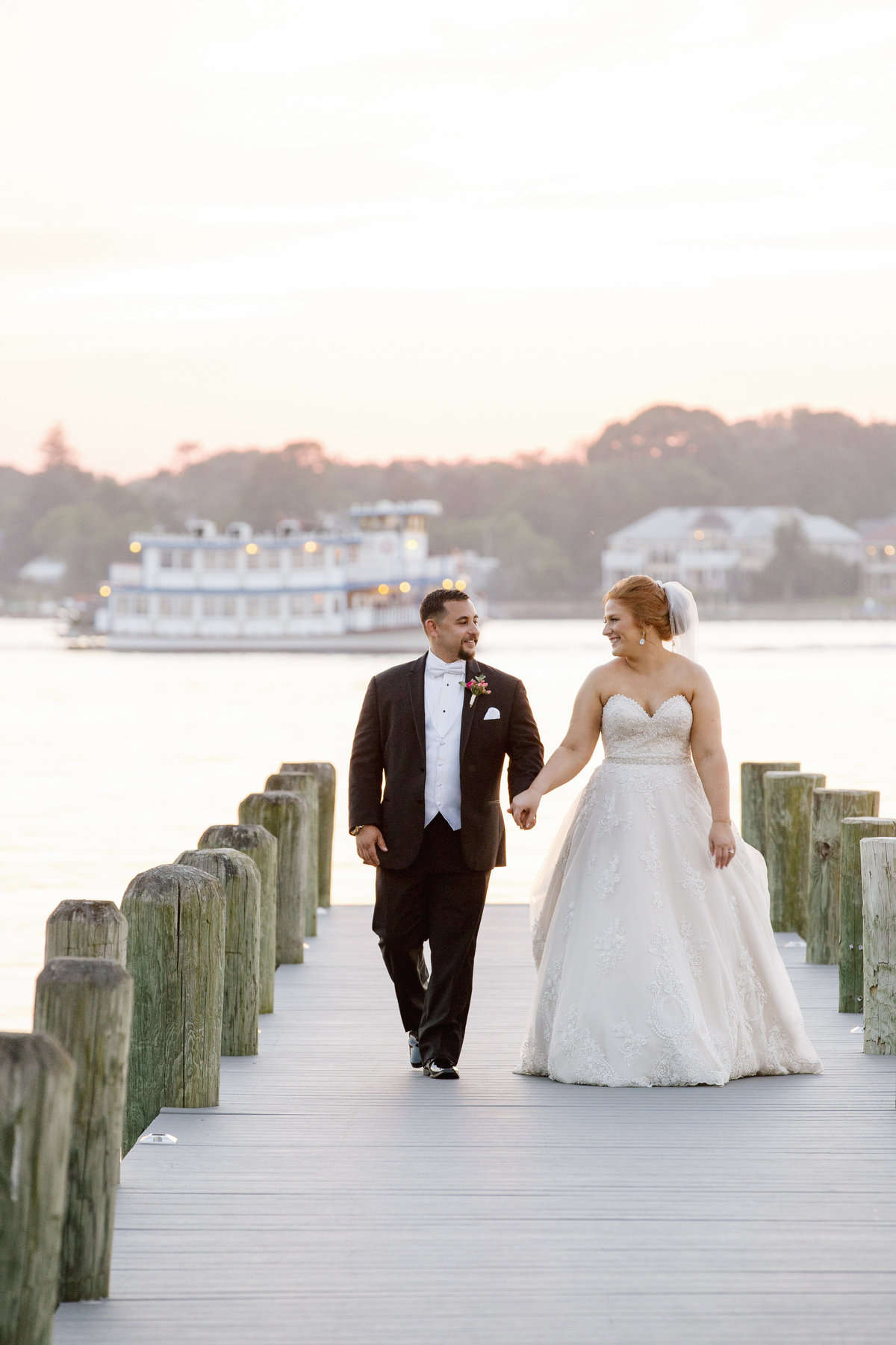 bride and groom on dock at clarks landing yacht club wedding