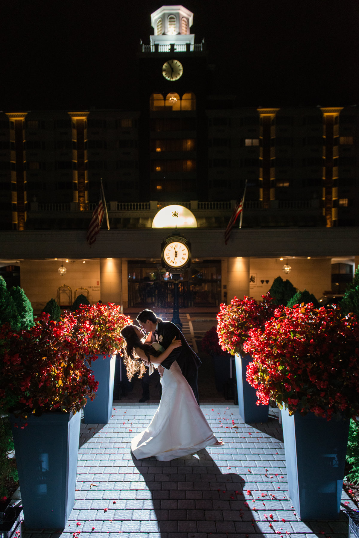 night shot of bride and groom outdoors during wedding at The Garden City Hotel