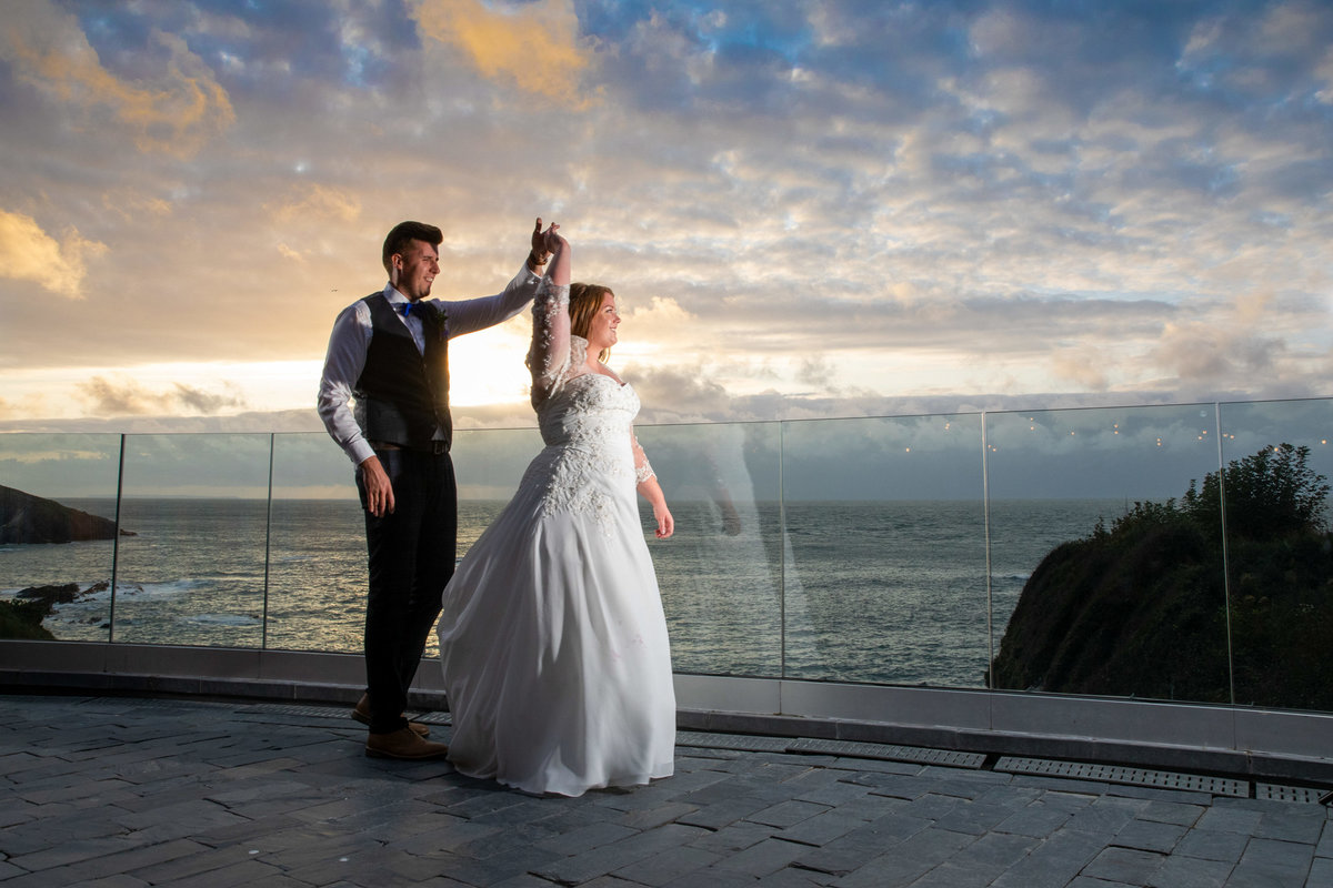 Wedding couple having a dance at Tunnels Beaches wedding venue in Devon
