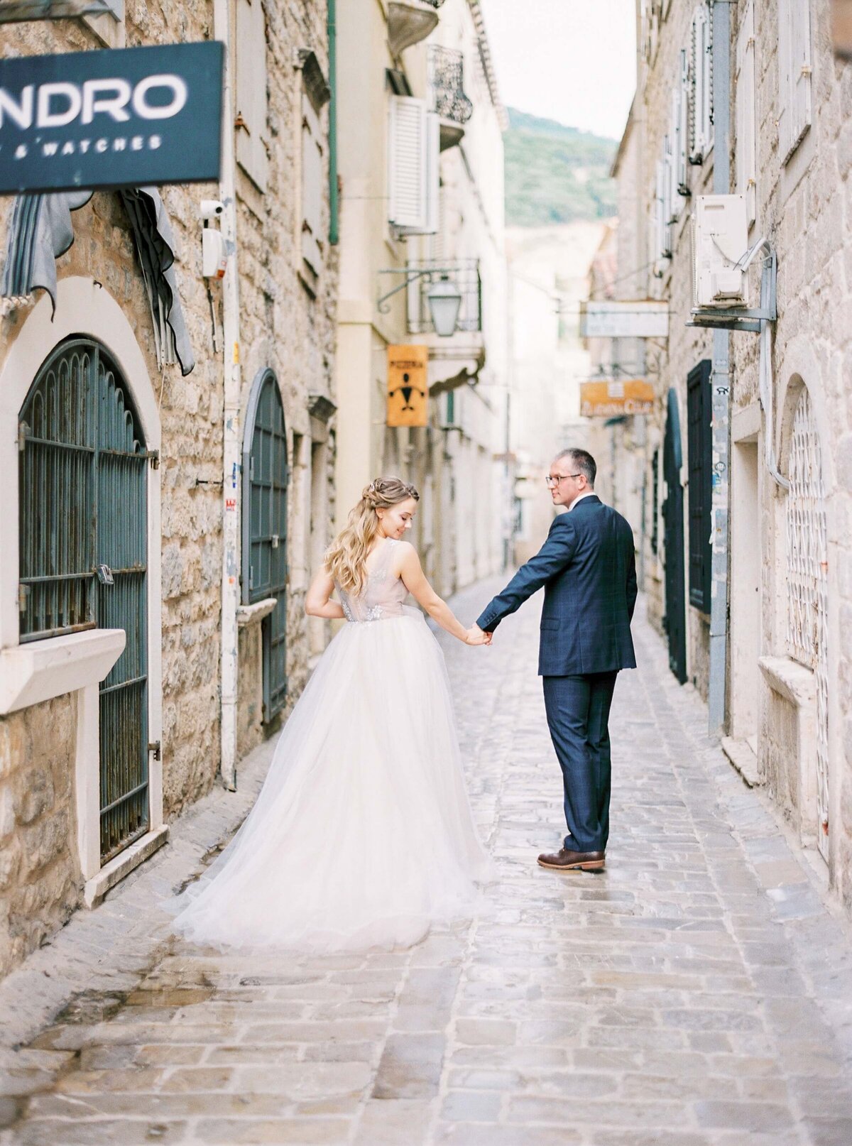 bride-and-groom-holding-hands