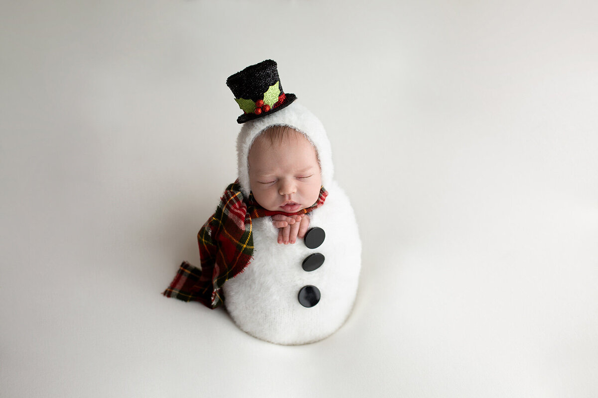 newborn in snowman outfit