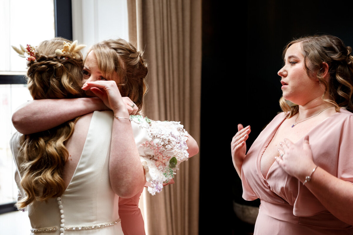 bridesmaids getting emotional when seeing bride for the first time