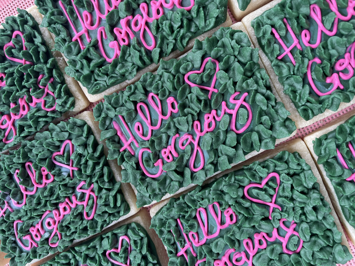 Custom-designed sugar cookies with intricate icing details, perfect for events, made in Gilbert.