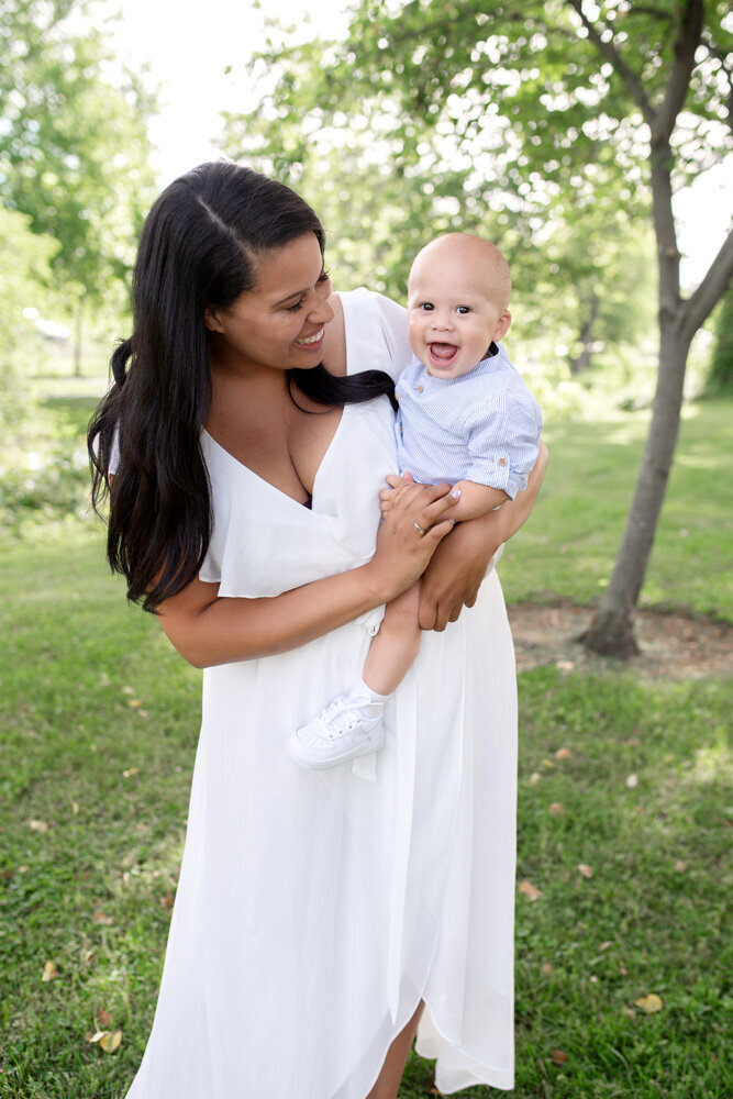 Family session of little boy and mother wearing a dress