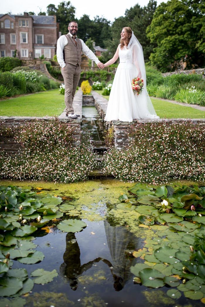 Bride & Groom reflected in the Rill at Hestercombe Gardens Somerset