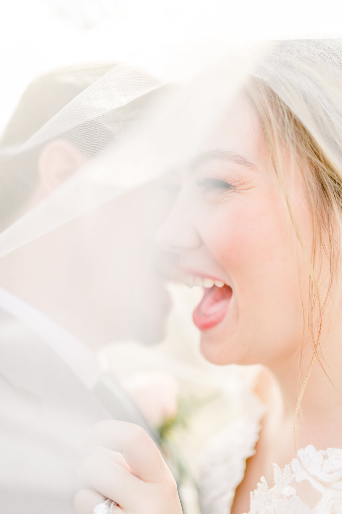 Eau Claire WEdding photographers Chippewa Falls Bride and groom laugh together