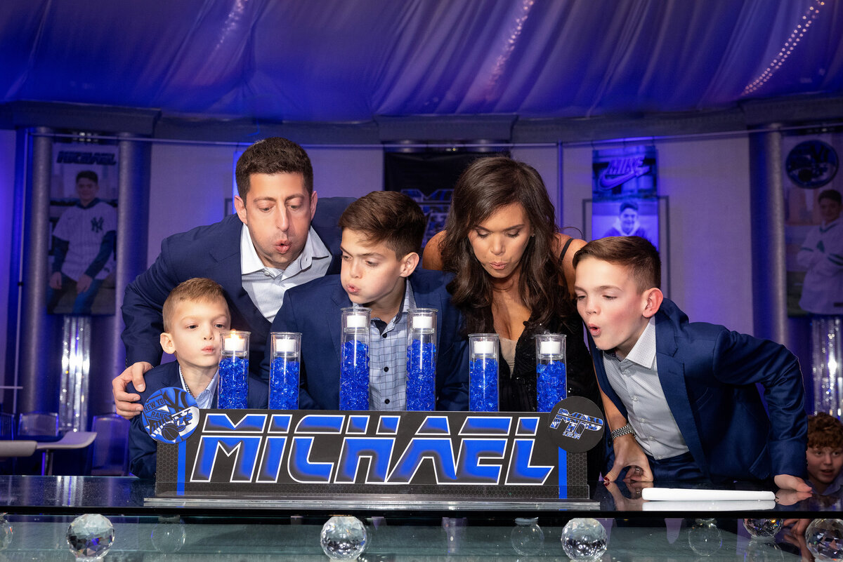 bar-mitzvah-family-blowing-candles-bnai-tikvah