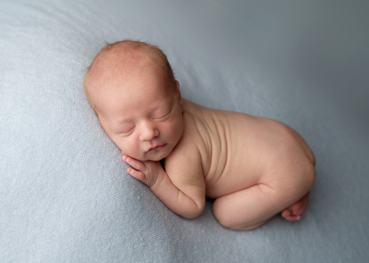 Newborn session of baby boy sleeping