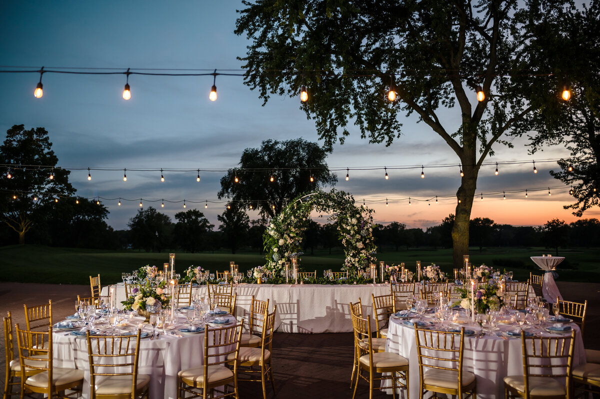 Outdoor wedding reception at sunset at Skokie Country Club