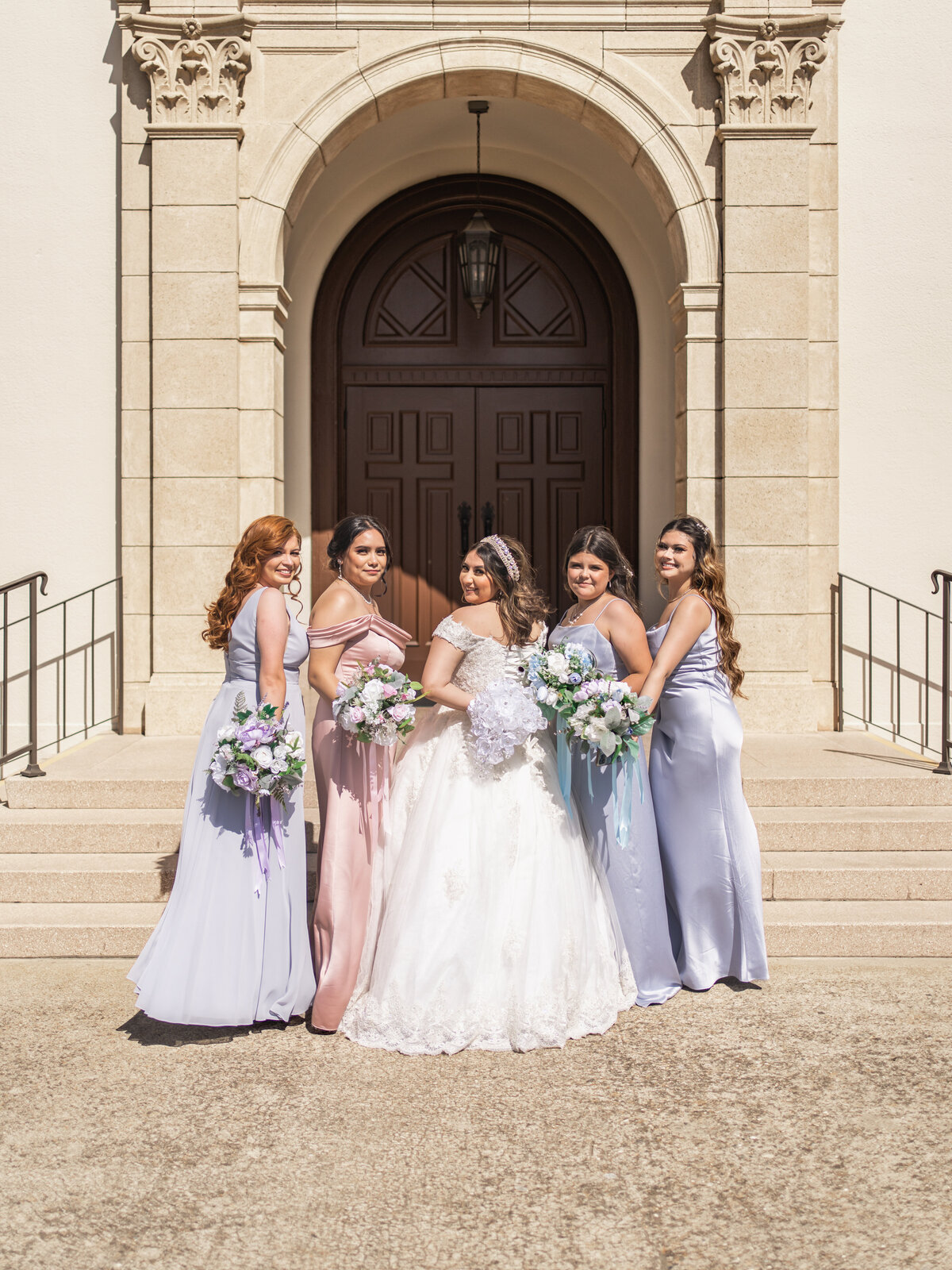 Brides and bridesmaids in front of a church in San Francisco