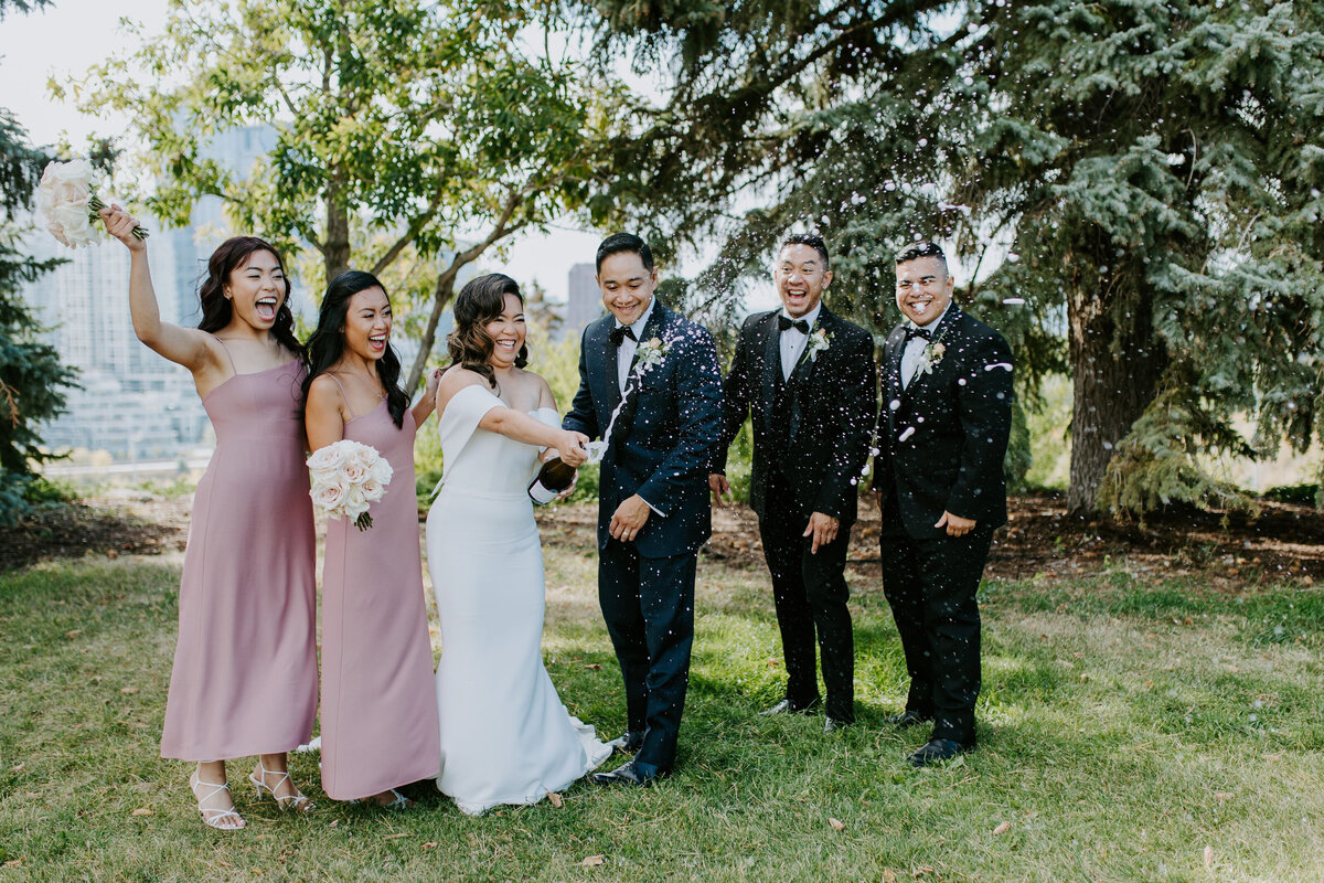 Fun bridal party champagne pop, wedding planned by Fiore Fine Events, an elegant wedding planner based in Calgary, Alberta.  Featured on the Brontë Bride Vendor Guide.