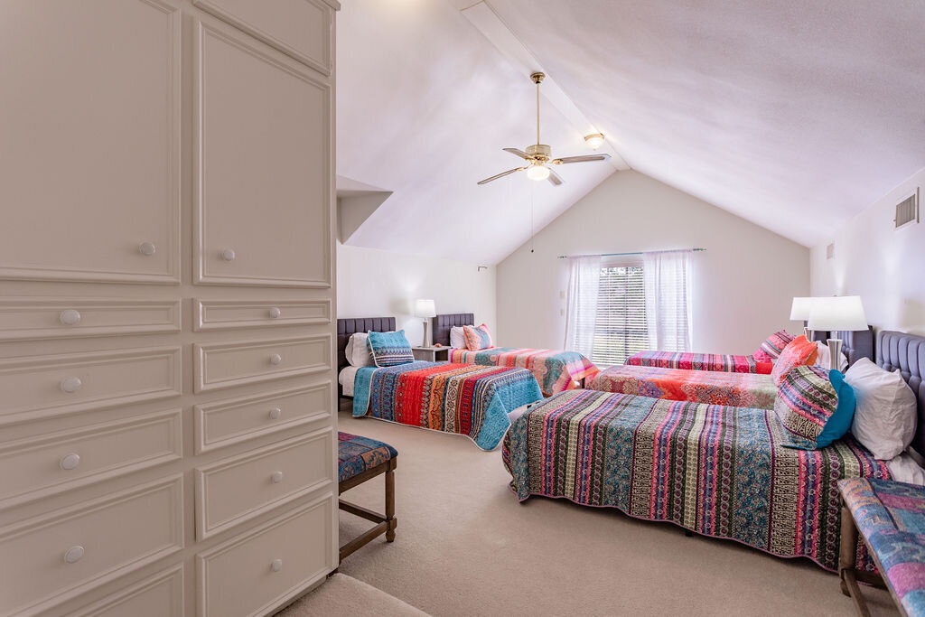 Bedroom with five beds in this 5-bedroom, 4-bathroom vacation rental house for 16+ guests with pool, free wifi, guesthouse and game room just 20 minutes away from downtown Waco, TX.