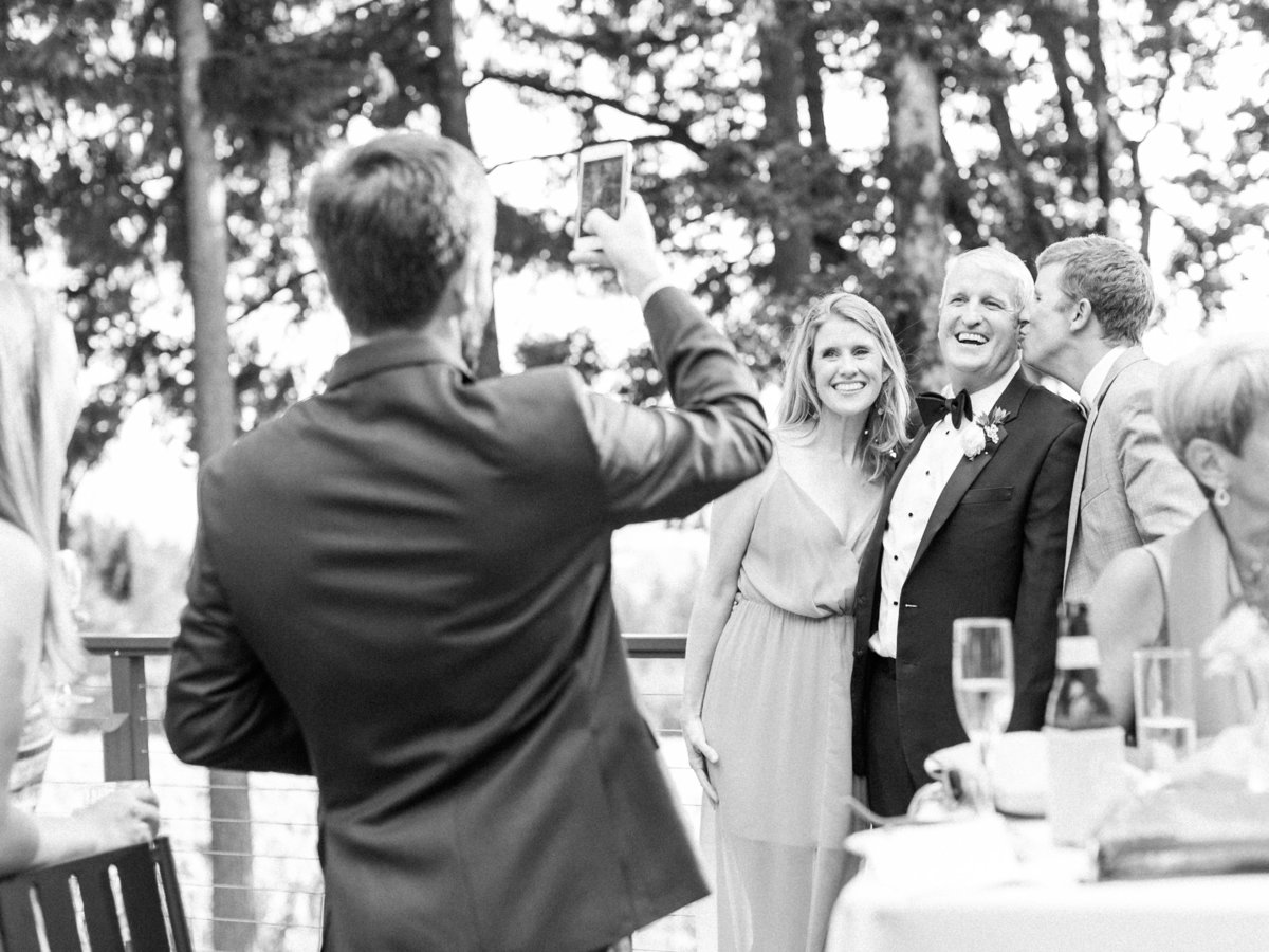 guests taking photos during cocktail hour