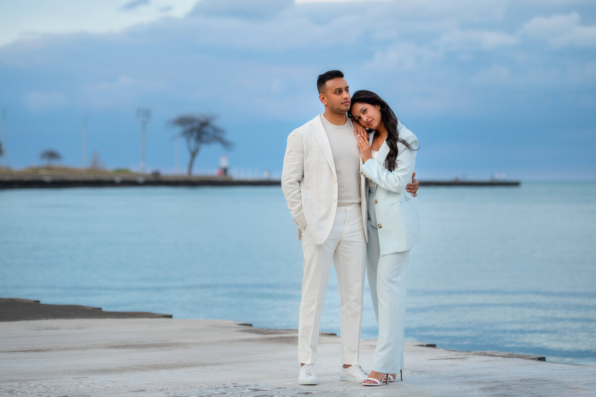 Blue sky and blue lake Michigan water is beautiful natural background for engaged couple in Chicago