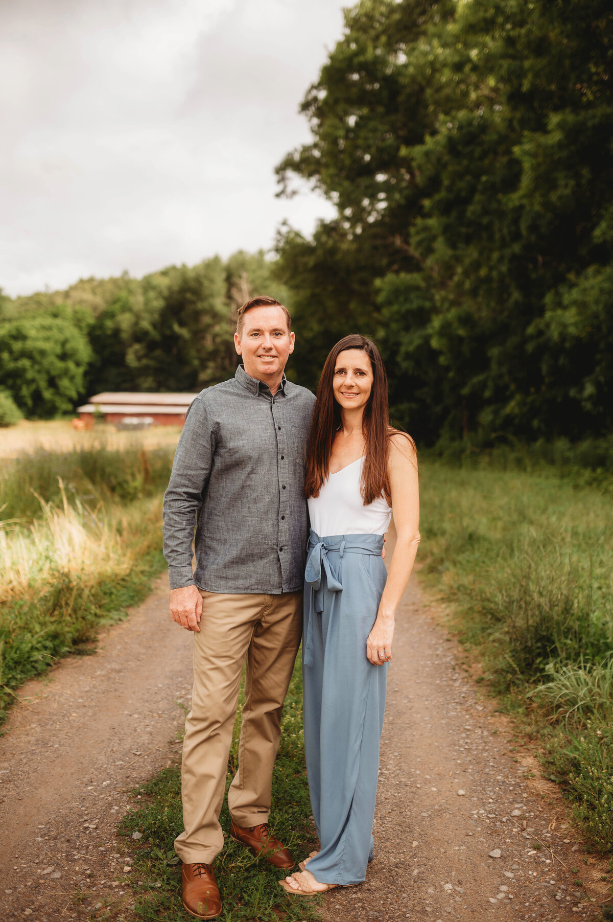 Couple poses for Portraits during an Extended Family Photoshoot in Asheville, NC.
