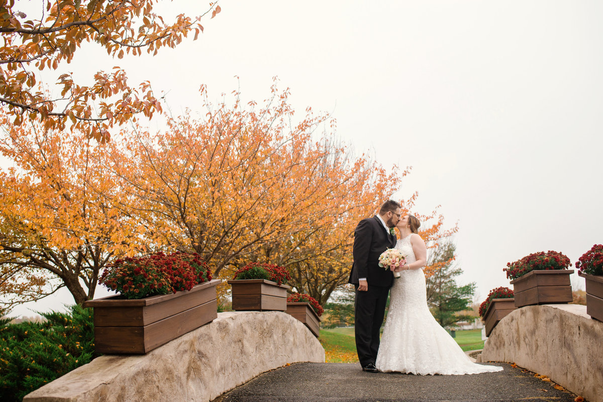 fall wedding photo of bride and groom outside at Willow Creek Golf and Country Club