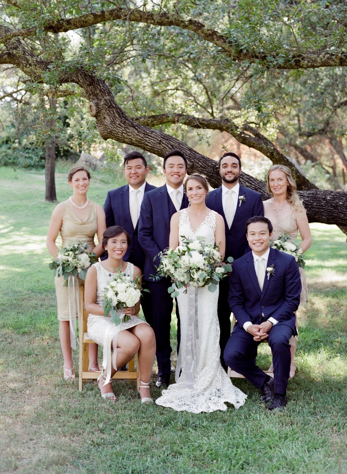 Wedding photographer Robin Jolin captures newly-wed wife and husband with their family members at a ranch wedding.