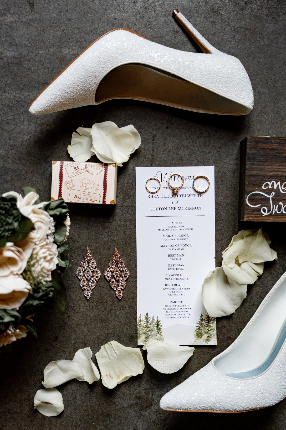 Flat lay of shoes rings jewelry and flowers