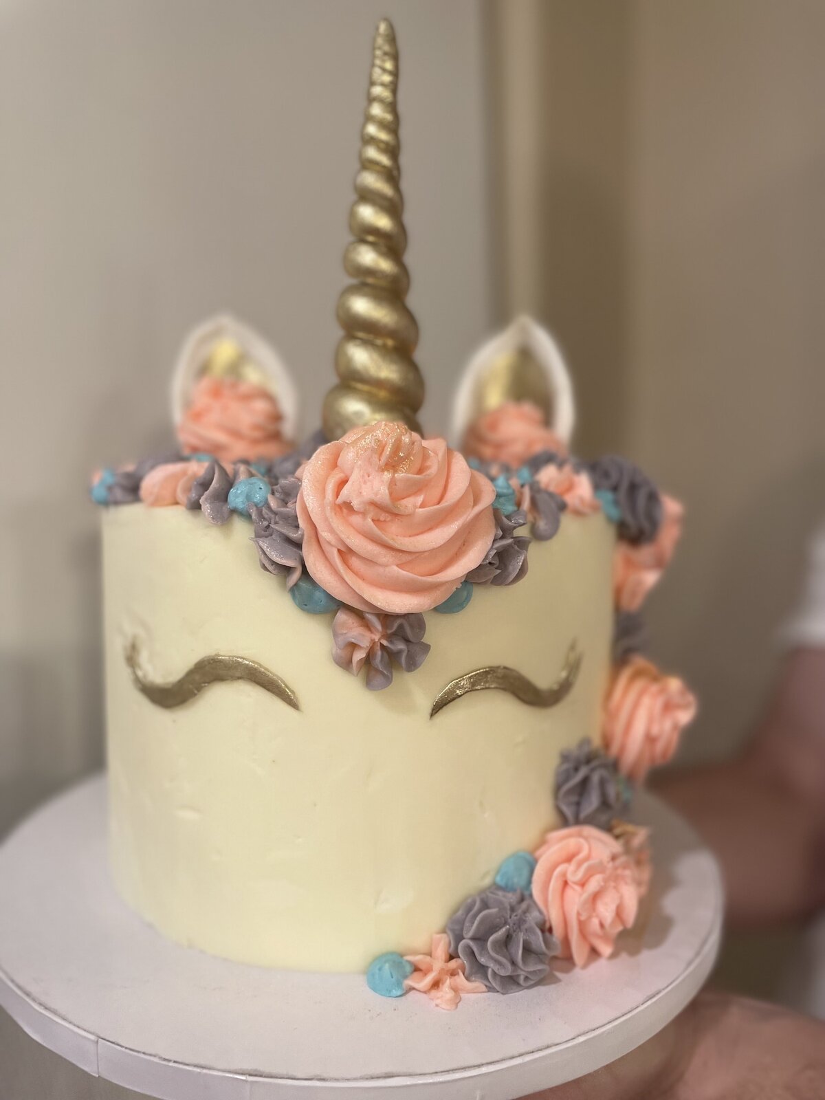 Elegant unicorn birthday cake decorated with flowers, created in Gilbert, AZ.