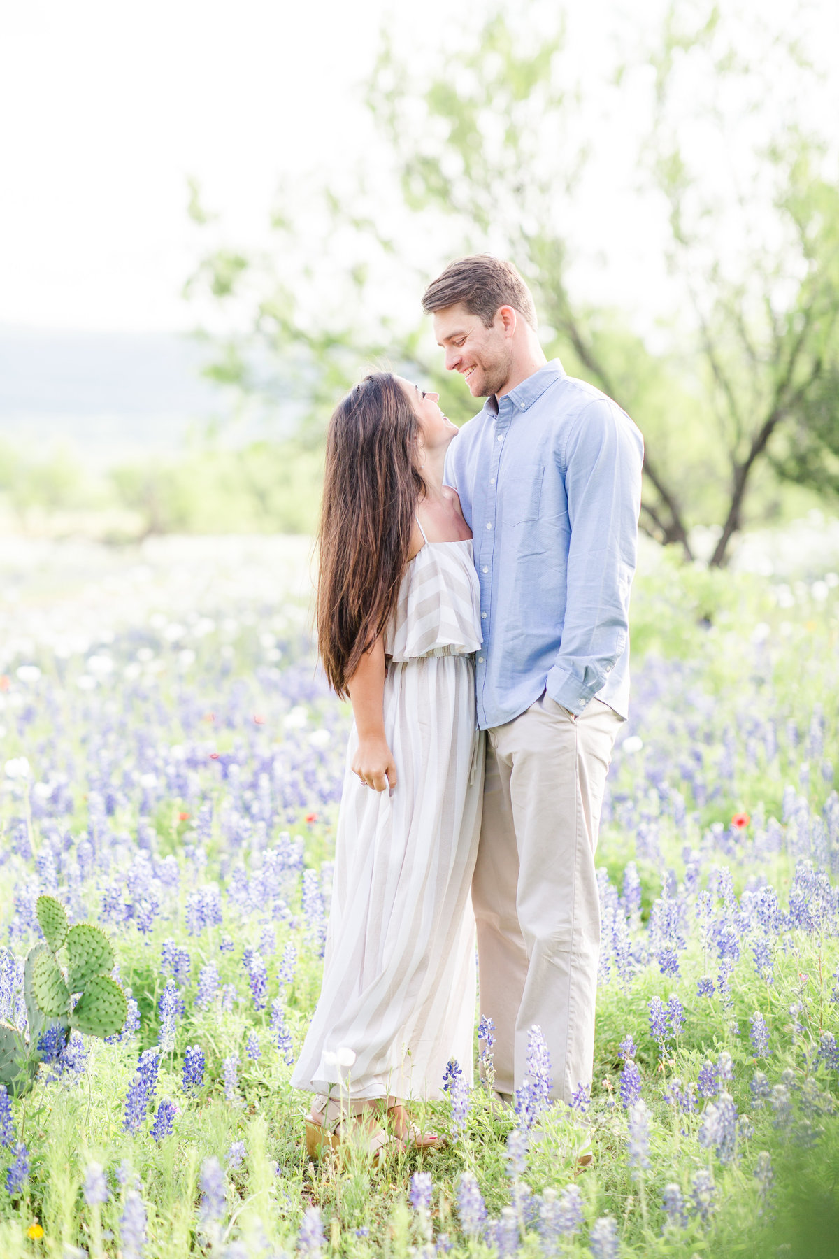 Engagement portraits in Texas bluebonnet field
