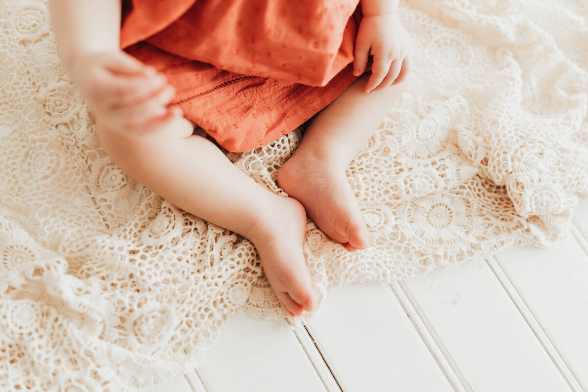 details shot of baby girls toes at milestone session.