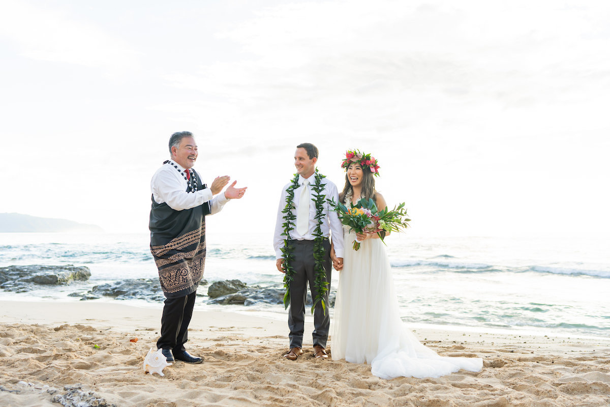 bride and groom getting married on the beach in Oahu