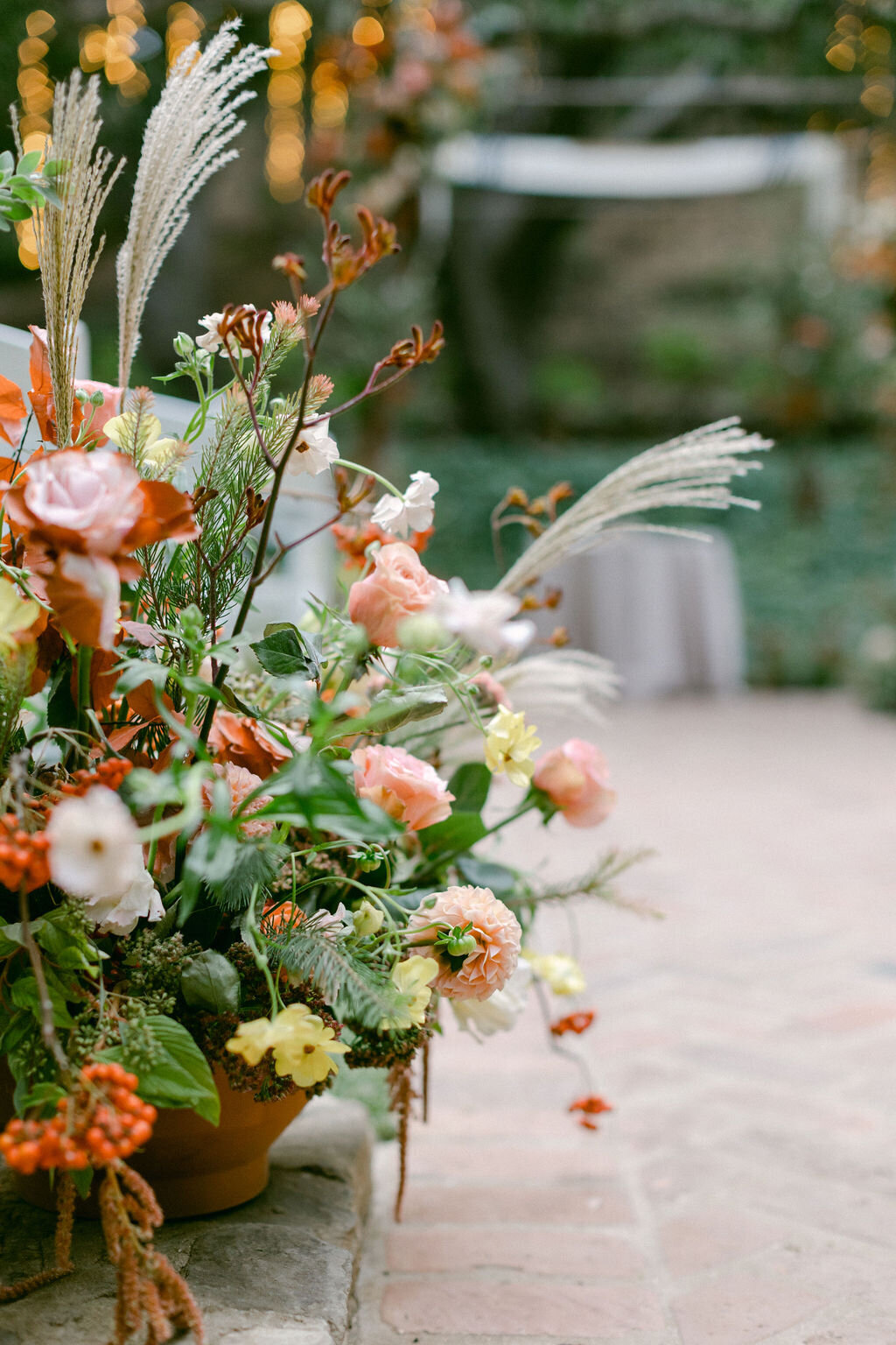floral centerpiece on the aisle with fall flowers