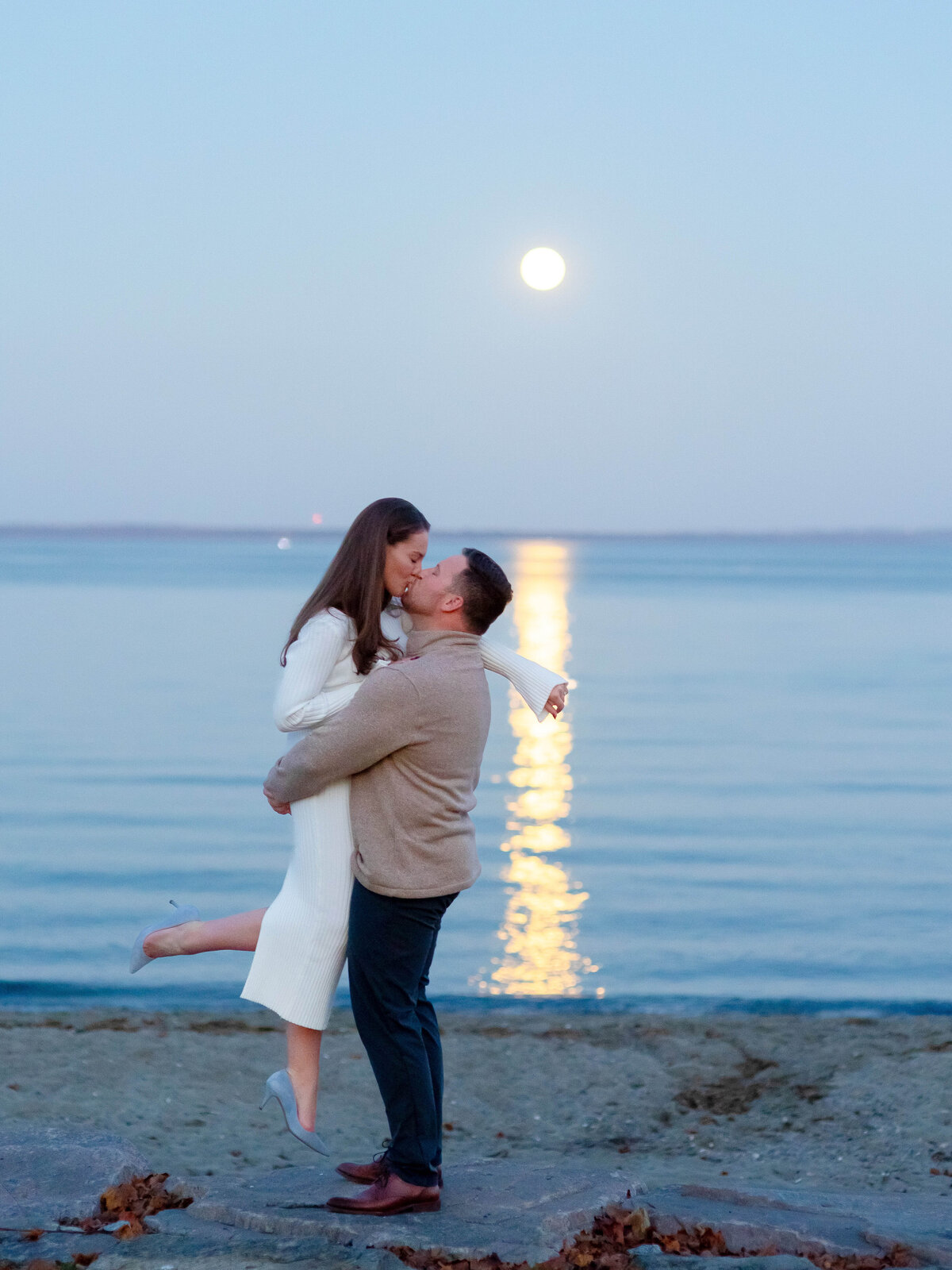 engaged-couple-moon-beach