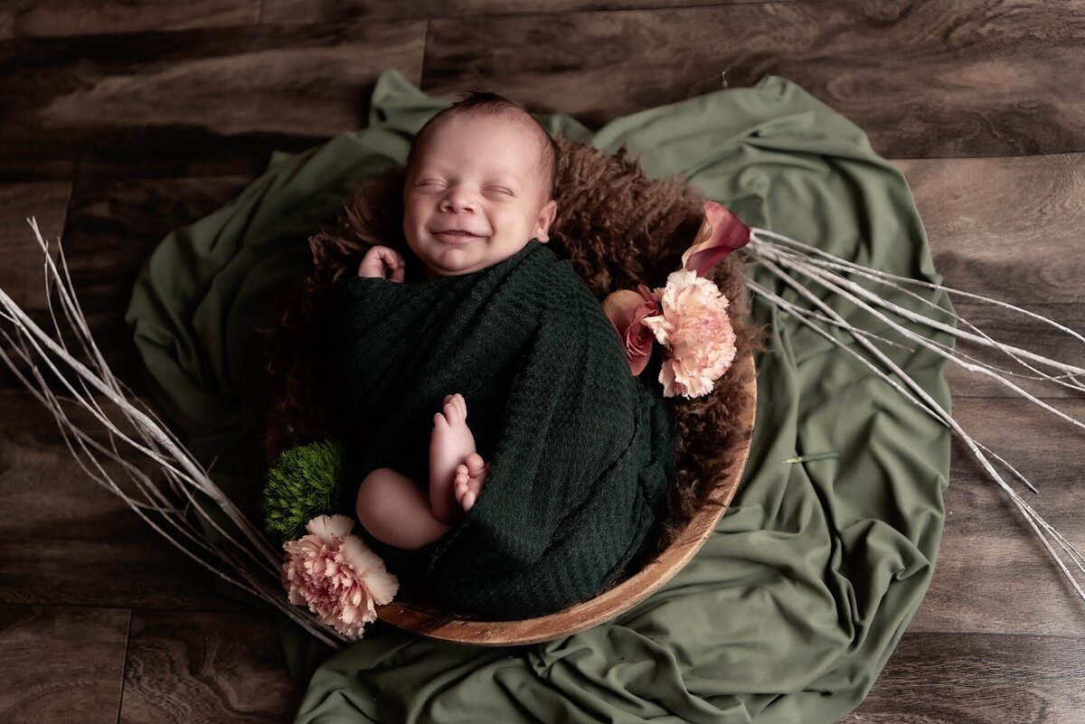Content newborn baby in basket