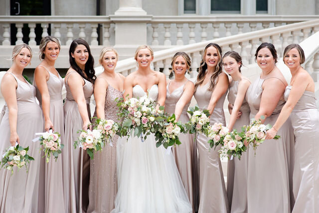 Bridesmaids standing together and smiling