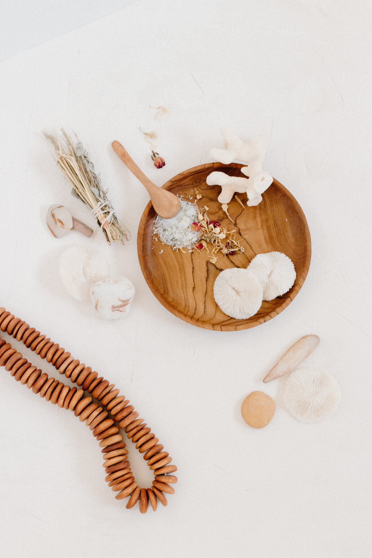 bath salts shells and disc beads on wooden trays