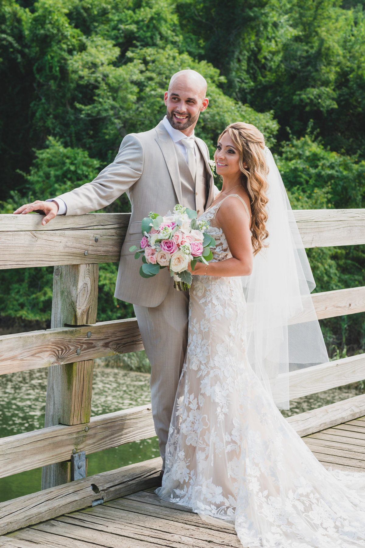 photo of bride and groom on the bridge from beach wedding agt Pavilion at Sunken Meadow