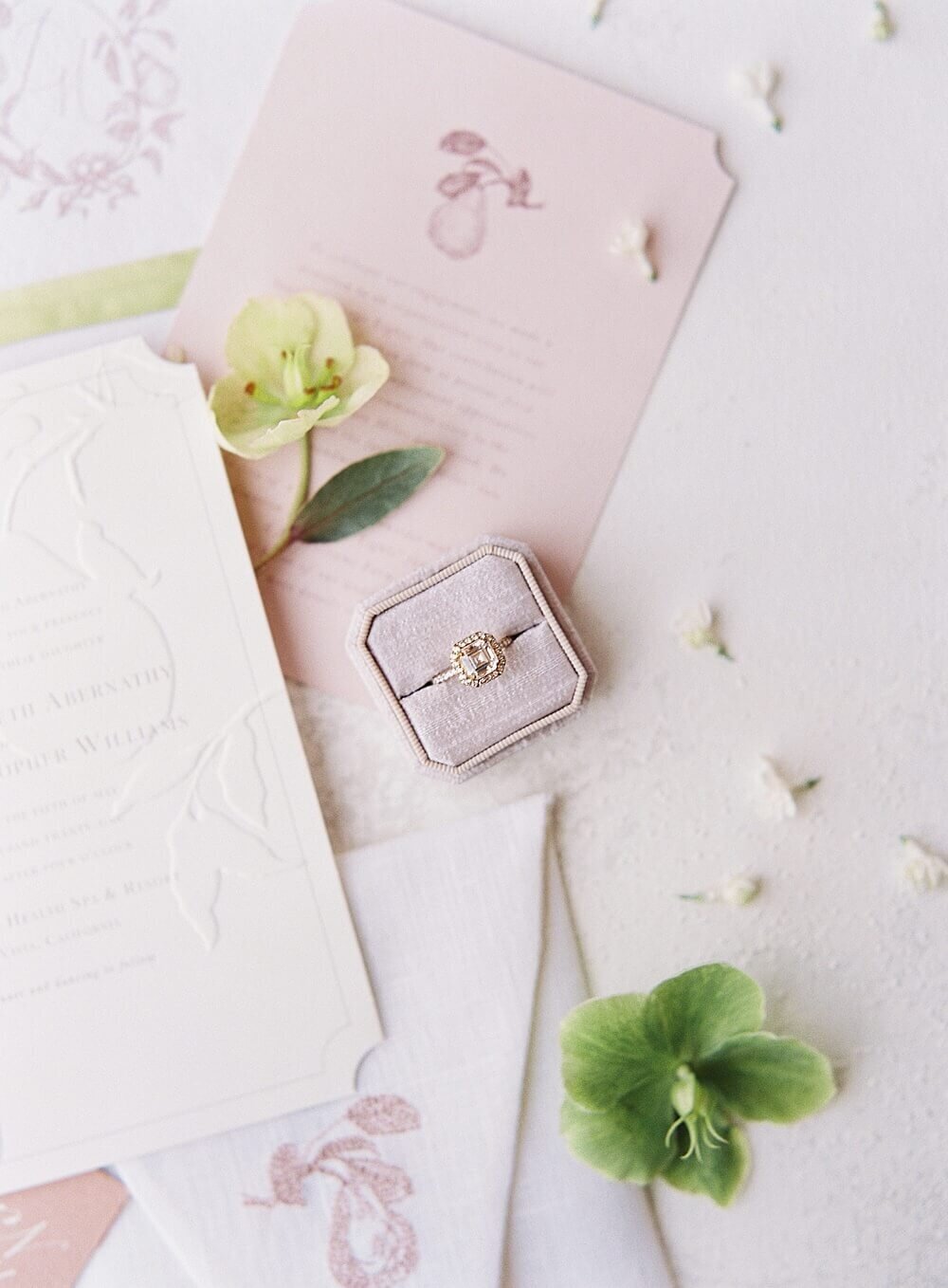 wedding stationary with engagement ring in pink mauve green at cal-a-vie | Jacqueline Benét