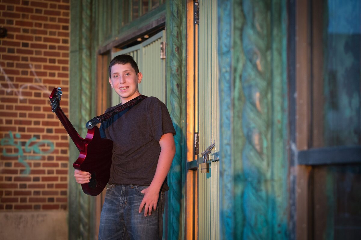 bar-mitzvah-preshoot-boy-holding-guitar-stone-pony