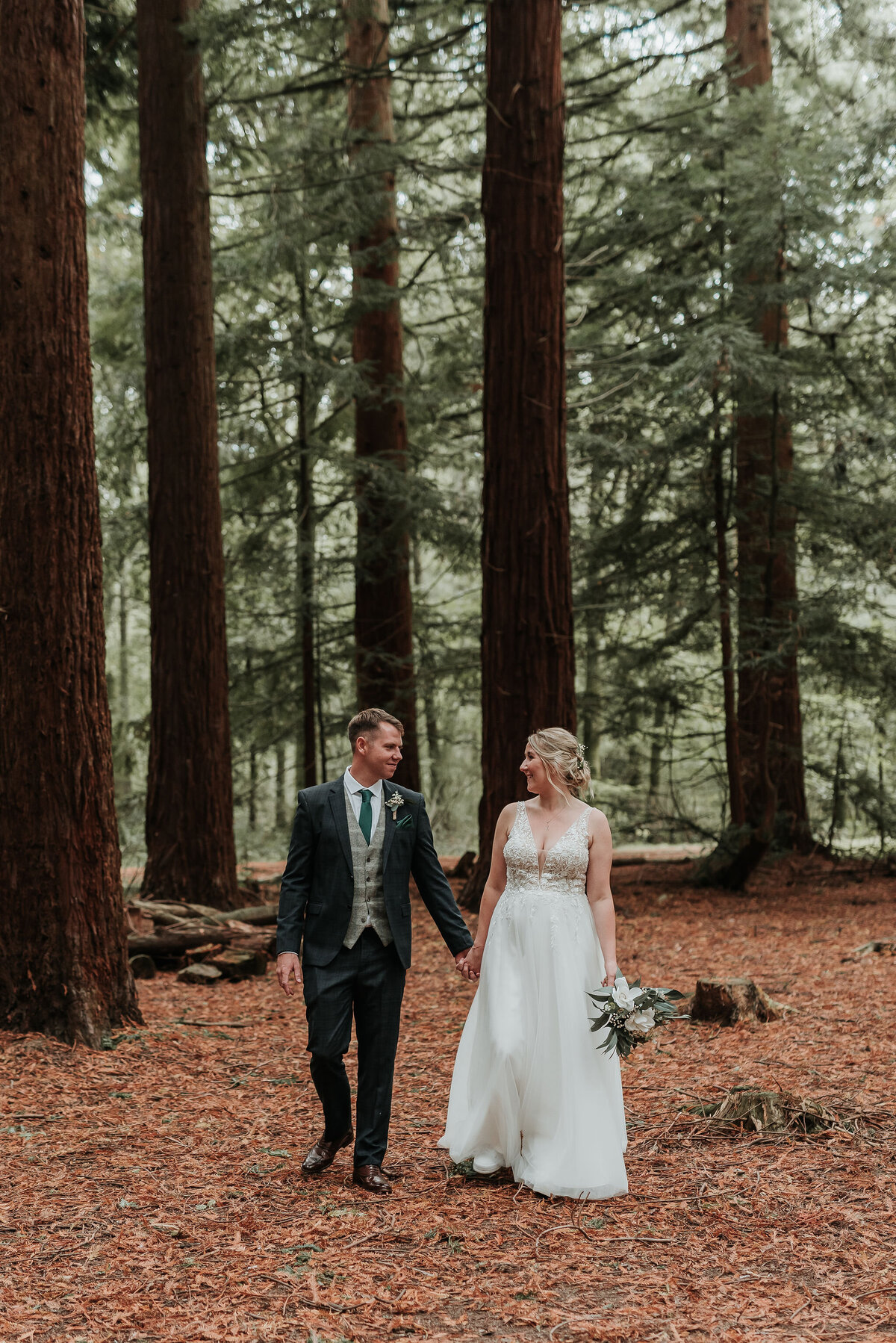 Bride & Groom walking through Redwoods at Two Woods Estate