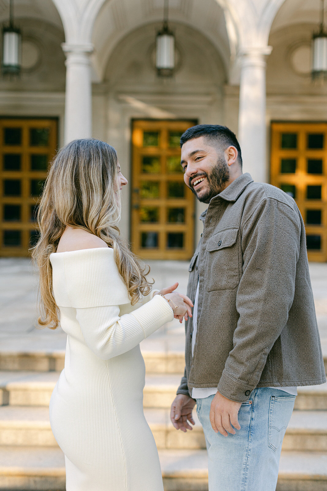 Couple embracing during golden hour engagement session in a Pittsburgh park