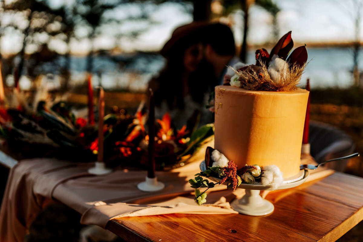 wedding cake on table at lake