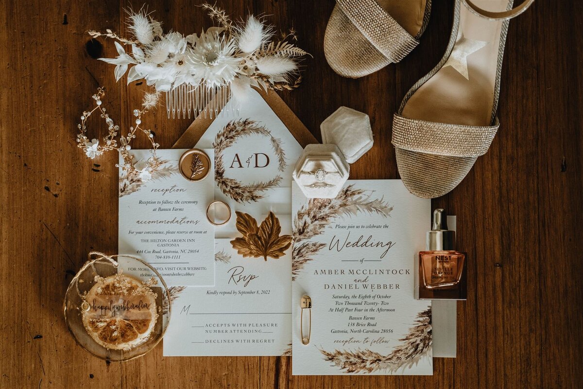 Flatlay of Bridal Details with ivory, gold and orange elements.