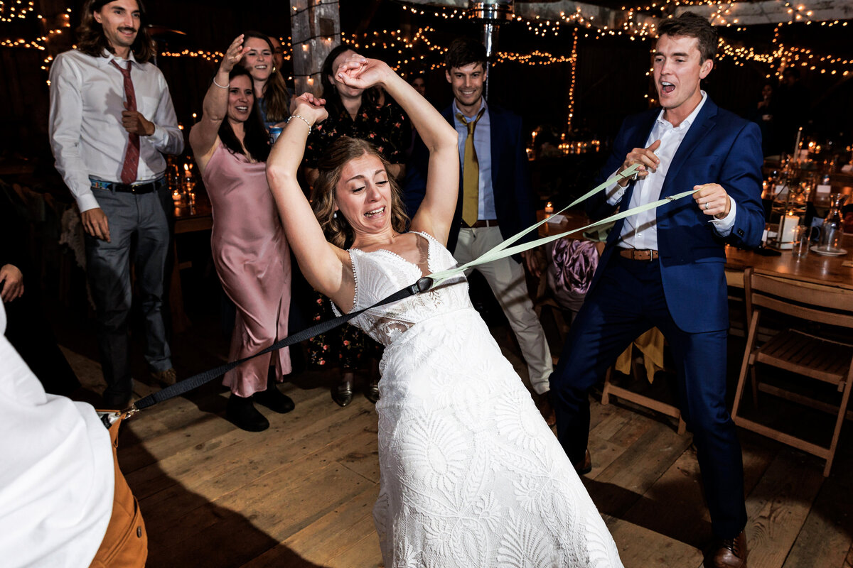 Bride does the limbo at the NH wedding reception