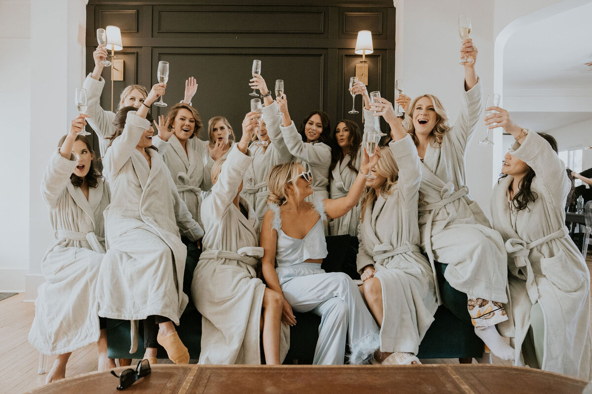 Bridal party with the bride in bath robes on the wedding day at the St Vrain wedding venue