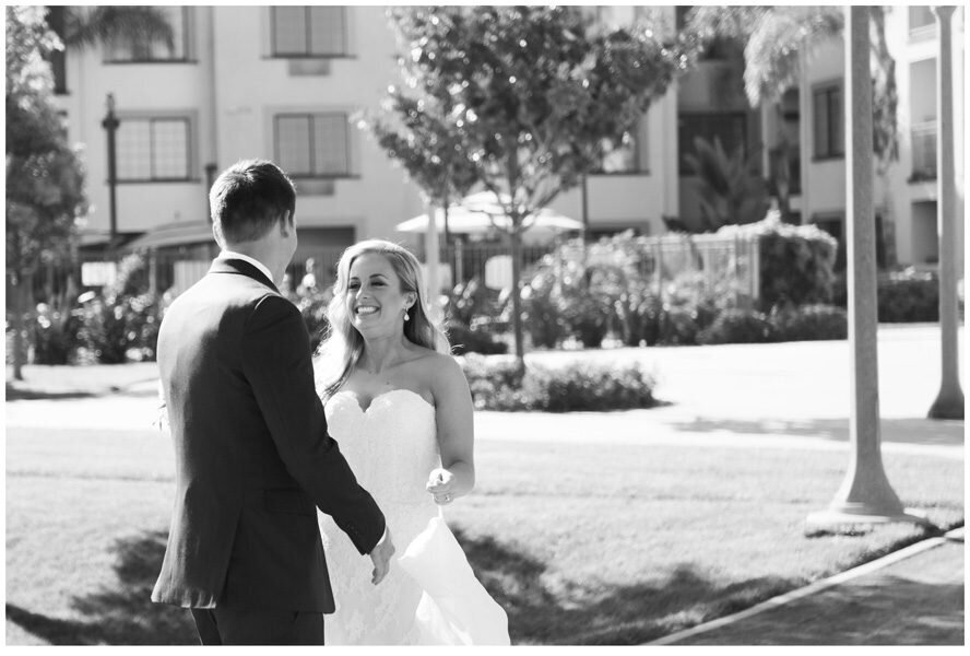 A bride smiles at her groom as they see each other for the first time on their wedding day, captured by Denver wedding photographer. Two One Photography.