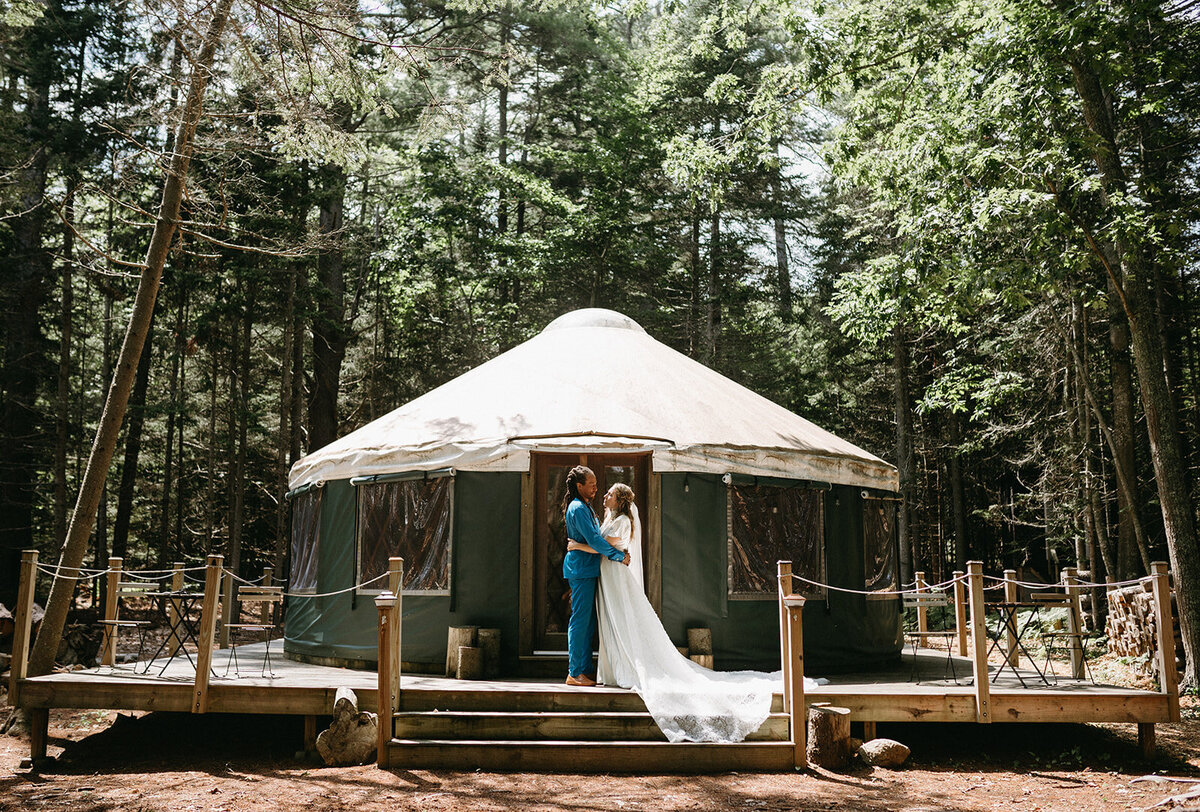 Outdoor wedding venue in Maine with couple in front