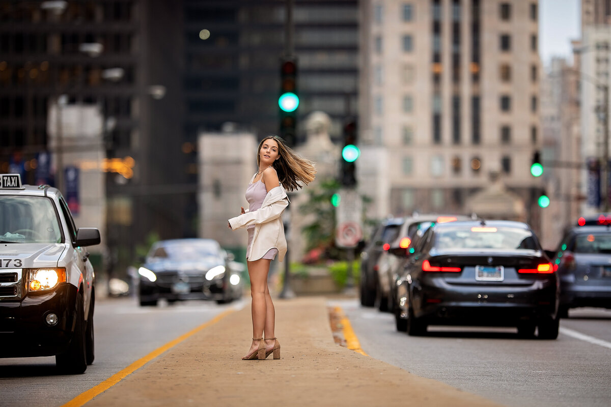 High school senior doing a catwalk in the middle of Michigan Avenue in Downtown Chicago